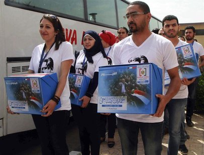 Youths working for leftist politician Hamdeen Sabahi submit boxes of endorsements collected as Sabahi arrives to submit his bid to run as pr Youths working for leftist politician Hamdeen Sabahi submit boxes of endorsements collected as Sabahi arrives to submit his bid to run as pr