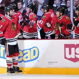 Jan 12, 2014; Chicago, IL, USA; Chicago Blackhawks defenseman Brent Seabrook (7) is congratulated by his teammates for scoring a goal agains Jan 12, 2014; Chicago, IL, USA; Chicago Blackhawks defenseman Brent Seabrook (7) is congratulated by his teammates for scoring a goal agains