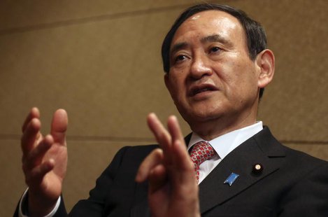 Japan's Chief Cabinet Secretary Yoshihide Suga speaks during an interview with Reuters in Tokyo February 15, 2014. To match interview JAPAN- Japan's Chief Cabinet Secretary Yoshihide Suga speaks during an interview with Reuters in Tokyo February 15, 2014. To match interview JAPAN-