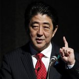 Japan's Prime Minister Shinzo Abe gestures as he gives a keynote address at Japan Summit 2014 hosted by the Economist magazine in Tokyo Apri Japan's Prime Minister Shinzo Abe gestures as he gives a keynote address at Japan Summit 2014 hosted by the Economist magazine in Tokyo Apri