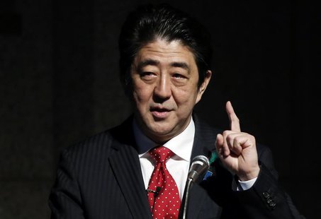 Japan's Prime Minister Shinzo Abe gestures as he gives a keynote address at Japan Summit 2014 hosted by the Economist magazine in Tokyo Apri Japan's Prime Minister Shinzo Abe gestures as he gives a keynote address at Japan Summit 2014 hosted by the Economist magazine in Tokyo Apri