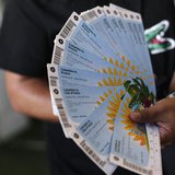 A Colombian fan displays his FIFA 2014 World Cup tickets for the match between Colombia and Greece, in Rio de Janeiro April 18, 2014. REUTER A Colombian fan displays his FIFA 2014 World Cup tickets for the match between Colombia and Greece, in Rio de Janeiro April 18, 2014. REUTER