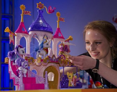 Toy demonstrator Christa Sparks shows off the new "My Little Pony Pony Princess Wedding Castle" playset, part of a new line of wedding-theme Toy demonstrator Christa Sparks shows off the new "My Little Pony Pony Princess Wedding Castle" playset, part of a new line of wedding-theme