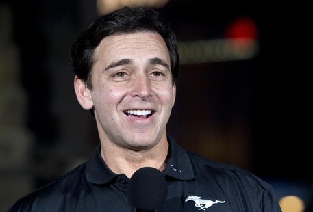 Mark Fields, chief operating officer for Ford Motor Company, speaks before unveiling a new 2015 Ford Mustang 50 Year Limited Edition in fron Mark Fields, chief operating officer for Ford Motor Company, speaks before unveiling a new 2015 Ford Mustang 50 Year Limited Edition in fron