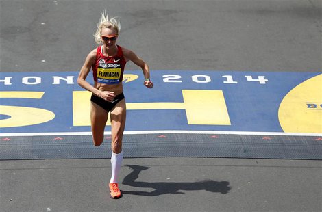 Apr 21, 2014; Boston, MA, USA; Shalane Flanagan (USA) crosses the finish line during the 2014 Boston Marathon. Mandatory Credit: Greg M. Coo Apr 21, 2014; Boston, MA, USA; Shalane Flanagan (USA) crosses the finish line during the 2014 Boston Marathon. Mandatory Credit: Greg M. Coo