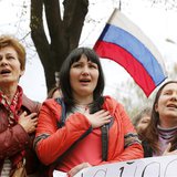 Pro-Russian supporters sing the Russian anthem during a meeting at the seized office of the SBU state security service in Luhansk, eastern U Pro-Russian supporters sing the Russian anthem during a meeting at the seized office of the SBU state security service in Luhansk, eastern U