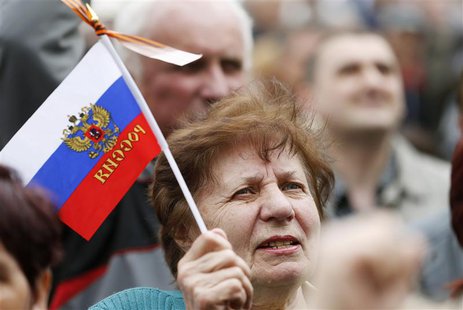 A pro-Russian supporter attends a meeting at the seized office of the SBU state security service in Luhansk, eastern Ukraine April 21, 2014. A pro-Russian supporter attends a meeting at the seized office of the SBU state security service in Luhansk, eastern Ukraine April 21, 2014.