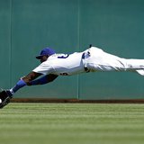 Los Angeles Dodgers center fielder Yasiel Puig attempts to make a diving catch of a fly ball off the bat of Cincinnati Reds' Brandon Phillip Los Angeles Dodgers center fielder Yasiel Puig attempts to make a diving catch of a fly ball off the bat of Cincinnati Reds' Brandon Phillip
