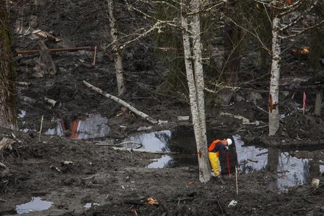 A rescue worker takes a break while working in a debris field left by a mudslide in Oso, Washington April 3, 2014. REUTERS/Max Whittaker A rescue worker takes a break while working in a debris field left by a mudslide in Oso, Washington April 3, 2014. REUTERS/Max Whittaker