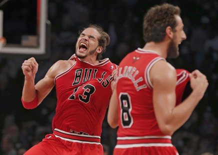 Chicago Bulls center Joakim Noah (13) and Chicago Bulls guard Marco Belinelli celebrate after they beat the Brooklyn Nets to advance to the Chicago Bulls center Joakim Noah (13) and Chicago Bulls guard Marco Belinelli celebrate after they beat the Brooklyn Nets to advance to the