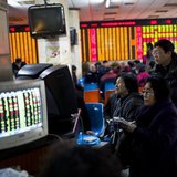 Investors look at computer screens showing stock information at a brokerage house in Shanghai, March 4, 2014. REUTERS/Aly Song Investors look at computer screens showing stock information at a brokerage house in Shanghai, March 4, 2014. REUTERS/Aly Song