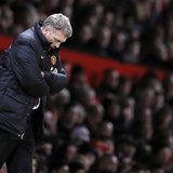 Then Manchester United's manager David Moyes reacts during their English Premier League soccer match against Swansea City at Old Trafford in Then Manchester United's manager David Moyes reacts during their English Premier League soccer match against Swansea City at Old Trafford in