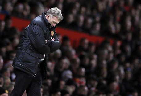 Then Manchester United's manager David Moyes reacts during their English Premier League soccer match against Swansea City at Old Trafford in Then Manchester United's manager David Moyes reacts during their English Premier League soccer match against Swansea City at Old Trafford in