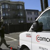 A Comcast sign is shown on the side of a vehicle in San Francisco, California February 13, 2014. REUTERS/Robert Galbraith A Comcast sign is shown on the side of a vehicle in San Francisco, California February 13, 2014. REUTERS/Robert Galbraith