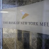 A woman walks past a logo at the office of the Bank of New York Mellon in Brussels, February 25, 2010. REUTERS/Sebastien Pirlet A woman walks past a logo at the office of the Bank of New York Mellon in Brussels, February 25, 2010. REUTERS/Sebastien Pirlet