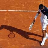 Novak Djokovic of Serbia reacts after missing a point during his match against Roger Federer of Switzerland during their semi-final match at Novak Djokovic of Serbia reacts after missing a point during his match against Roger Federer of Switzerland during their semi-final match at