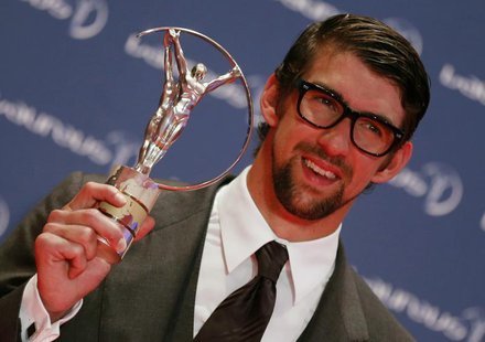 U.S. Olympic swimmer Michael Phelps poses with his Special Laureus Award during the 2013 Laureus World Sports Awards, at Municipal Theater i U.S. Olympic swimmer Michael Phelps poses with his Special Laureus Award during the 2013 Laureus World Sports Awards, at Municipal Theater i