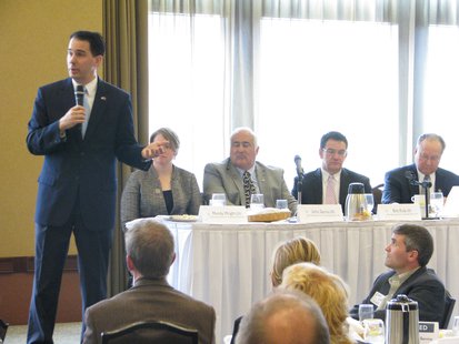 Governor Scott Walker addresses Wausau Chamber of Commerce. Seated at the table Left to Right: State Representatives Mandy Wright, John Spiros, Bob Kulp, and Senator Jerry Petrowski Governor Scott Walker addresses Wausau Chamber of Commerce. Seated at the table Left to Right: State Representatives Mandy Wright, John Spiros, Bob Kulp, and Senator Jerry Petrowski