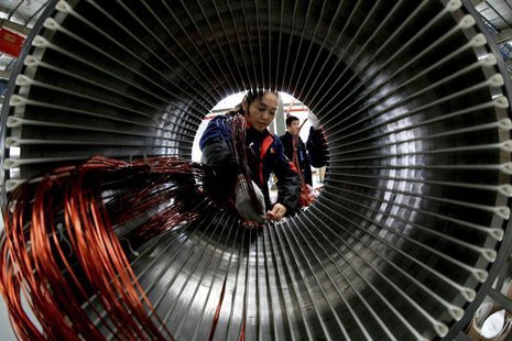 A worker assembles a generator at a factory in Hefei, Anhui province November 2, 2013. REUTERS/China Daily A worker assembles a generator at a factory in Hefei, Anhui province November 2, 2013. REUTERS/China Daily