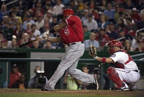 Apr 22, 2014; Washington, DC, USA; Los Angeles Angels first baseman Albert Pujols (5) hits a two-run home run during the fifth inning agains Apr 22, 2014; Washington, DC, USA; Los Angeles Angels first baseman Albert Pujols (5) hits a two-run home run during the fifth inning agains