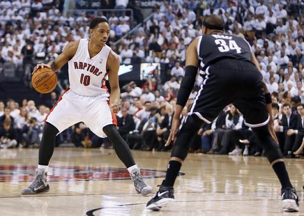Apr 22, 2014; Toronto, Ontario, CAN; Toronto Raptors guard DeMar DeRozan (10) controls the ball against Brooklyn Nets forward Paul Pierce (3 Apr 22, 2014; Toronto, Ontario, CAN; Toronto Raptors guard DeMar DeRozan (10) controls the ball against Brooklyn Nets forward Paul Pierce (3