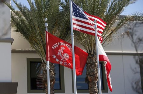 Flags flutter outside the Huy Fong Foods factory, maker of Sriracha hot chili sauce, in Irwindale, California October 30, 2013. REUTERS/Lucy Flags flutter outside the Huy Fong Foods factory, maker of Sriracha hot chili sauce, in Irwindale, California October 30, 2013. REUTERS/Lucy