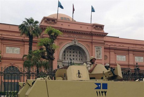 A soldier in a military vehicle keeps guard in front of the Egyptian Museum in Tahrir square in Cairo April 19, 2014. Picture taken April 19 A soldier in a military vehicle keeps guard in front of the Egyptian Museum in Tahrir square in Cairo April 19, 2014. Picture taken April 19