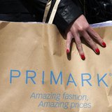 A shopper passes demonstrators outside clothing retailer Primark in London April 27, 2013.REUTERS/Suzanne Plunkett A shopper passes demonstrators outside clothing retailer Primark in London April 27, 2013.REUTERS/Suzanne Plunkett