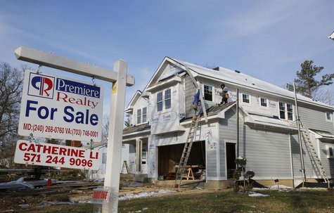 A new home is being built next to a home with a for sale sign on a street in Vienna, on the morning the National Association of Realtors iss A new home is being built next to a home with a for sale sign on a street in Vienna, on the morning the National Association of Realtors iss