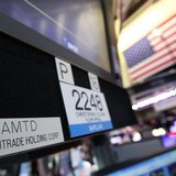 A sign with the ticker symbol for TD Ameritrade is seen at the trading post that trades the company on the floor of the New York Stock Excha A sign with the ticker symbol for TD Ameritrade is seen at the trading post that trades the company on the floor of the New York Stock Excha