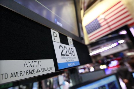 A sign with the ticker symbol for TD Ameritrade is seen at the trading post that trades the company on the floor of the New York Stock Excha A sign with the ticker symbol for TD Ameritrade is seen at the trading post that trades the company on the floor of the New York Stock Excha