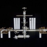 Backdropped by the blackness of space, the International Space Station is seen in this image taken by a crew member aboard the Space Shuttle Backdropped by the blackness of space, the International Space Station is seen in this image taken by a crew member aboard the Space Shuttle