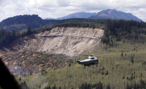 Marine One carrying U.S. President Barack Obama tours the mud slide damage in Oso, Washington, April 22, 2014. REUTERS/Carolyn Kaster/Pool Marine One carrying U.S. President Barack Obama tours the mud slide damage in Oso, Washington, April 22, 2014. REUTERS/Carolyn Kaster/Pool