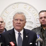 Georgia Governor Nathan Deal (C), speaks to the media as Public Safety Director Mark McDonough (L), and Georgia National Guard Director Gene Georgia Governor Nathan Deal (C), speaks to the media as Public Safety Director Mark McDonough (L), and Georgia National Guard Director Gene
