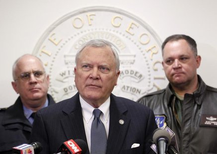 Georgia Governor Nathan Deal (C), speaks to the media as Public Safety Director Mark McDonough (L), and Georgia National Guard Director Gene Georgia Governor Nathan Deal (C), speaks to the media as Public Safety Director Mark McDonough (L), and Georgia National Guard Director Gene