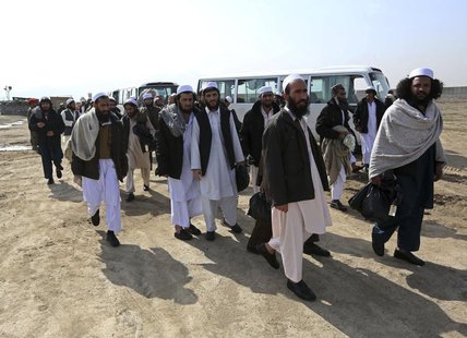 Afghan prisoners walk outside the Parwan Detention Facility after their release in Bagram Airbase, northern Kabul, March 20, 2014. REUTERS/O Afghan prisoners walk outside the Parwan Detention Facility after their release in Bagram Airbase, northern Kabul, March 20, 2014. REUTERS/O