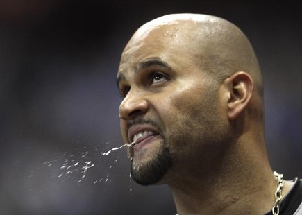 St. Louis Cardinals first baseman Albert Pujols spits in the dugout during Game 2 of the MLB National League Championship Series baseball pl St. Louis Cardinals first baseman Albert Pujols spits in the dugout during Game 2 of the MLB National League Championship Series baseball pl