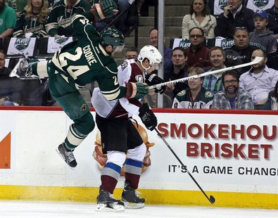 Apr 21, 2014; Saint Paul, MN, USA; Minnesota Wild forward Matt Cooke (24) hits Colorado Avalanche defenseman Nick Holden (2) during the firs Apr 21, 2014; Saint Paul, MN, USA; Minnesota Wild forward Matt Cooke (24) hits Colorado Avalanche defenseman Nick Holden (2) during the firs