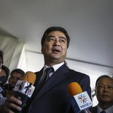 Democrat Party leader and former Prime Minister Abhisit Vejjajiva speaks to reporters after reporting to the Office of the Attorney General Democrat Party leader and former Prime Minister Abhisit Vejjajiva speaks to reporters after reporting to the Office of the Attorney General