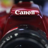 A logo of Canon Inc is pictured on a Canon EOS Kiss X50 displayed at an electronics store in Tokyo October 23, 2012. REUTERS/Yuriko Nakao A logo of Canon Inc is pictured on a Canon EOS Kiss X50 displayed at an electronics store in Tokyo October 23, 2012. REUTERS/Yuriko Nakao
