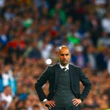Bayern Munich's coach Josep Guardiola reacts during the Champions League semi-final first leg soccer match against Real Madrid at Santiago B Bayern Munich's coach Josep Guardiola reacts during the Champions League semi-final first leg soccer match against Real Madrid at Santiago B