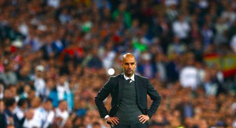 Bayern Munich's coach Josep Guardiola reacts during the Champions League semi-final first leg soccer match against Real Madrid at Santiago B Bayern Munich's coach Josep Guardiola reacts during the Champions League semi-final first leg soccer match against Real Madrid at Santiago B