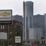 The sign to a Chevrolet automobile dealership is seen down the street from General Motors World Headquarters on Jefferson Avenue in Detroit, The sign to a Chevrolet automobile dealership is seen down the street from General Motors World Headquarters on Jefferson Avenue in Detroit,