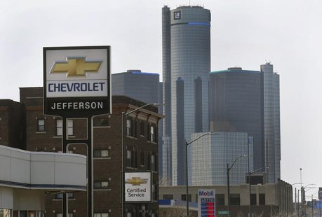 The sign to a Chevrolet automobile dealership is seen down the street from General Motors World Headquarters on Jefferson Avenue in Detroit, The sign to a Chevrolet automobile dealership is seen down the street from General Motors World Headquarters on Jefferson Avenue in Detroit,