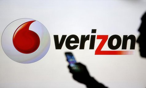 A man is silhouetted against a video screen with Vodafone and Verizon logos as he poses with a Samsung Galaxy S3 in this photo illustration A man is silhouetted against a video screen with Vodafone and Verizon logos as he poses with a Samsung Galaxy S3 in this photo illustration