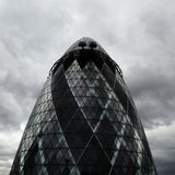 Dark clouds gather over 30 St. Mary Axe, formerly known as the Swiss RE building and also known as the Gherkin, in London August 12, 2010. R Dark clouds gather over 30 St. Mary Axe, formerly known as the Swiss RE building and also known as the Gherkin, in London August 12, 2010. R