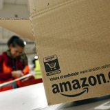 A worker packs a box at Amazon's logistics centre in Graben near Augsburg December 16, 2013. REUTERS/Michaela Rehle A worker packs a box at Amazon's logistics centre in Graben near Augsburg December 16, 2013. REUTERS/Michaela Rehle