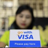 A Visa sign is seen on a cashier's desk at a restaurant in Yangon January 31, 2013. REUTERS/Soe Zeya Tun A Visa sign is seen on a cashier's desk at a restaurant in Yangon January 31, 2013. REUTERS/Soe Zeya Tun