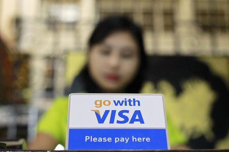A Visa sign is seen on a cashier's desk at a restaurant in Yangon January 31, 2013. REUTERS/Soe Zeya Tun A Visa sign is seen on a cashier's desk at a restaurant in Yangon January 31, 2013. REUTERS/Soe Zeya Tun