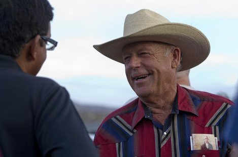 Rancher Cliven Bundy (R) greets a supporter during a Bundy family "Patriot Party" near Bunkerville, Nevada, April 18, 2014. REUTERS/Steve Ma Rancher Cliven Bundy (R) greets a supporter during a Bundy family "Patriot Party" near Bunkerville, Nevada, April 18, 2014. REUTERS/Steve Ma